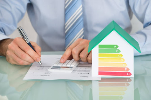 Homeowner calculating how much he can save with energy efficient tax credits.